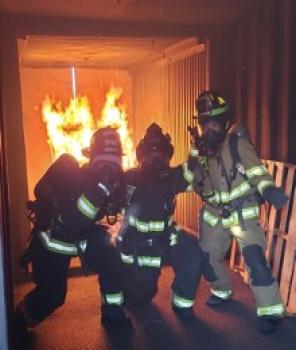 firefighters in front of a fire